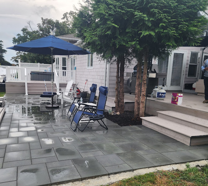 Bluestone patio installation with deck